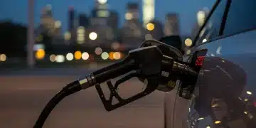 Gas pump with rising prices, reflecting 2026 oil price increase impact on US consumers.