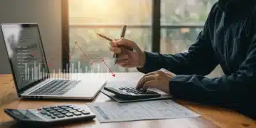 Self-employed person analyzing tax documents to reduce taxable income